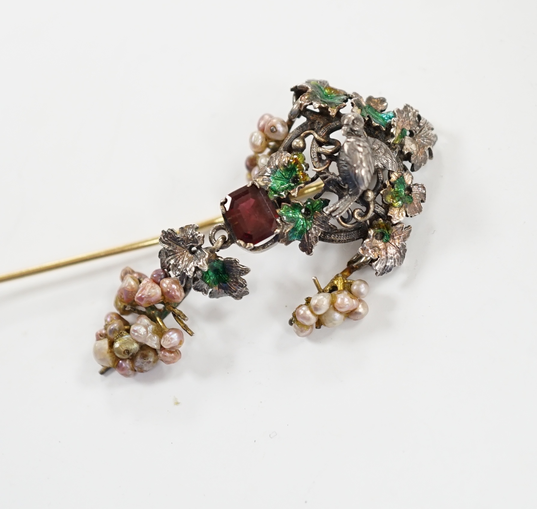 A 19th century Austro-Hungarian white metal garnet, enamel and seed baroque pearl set stick pin (adapted), 84mm.